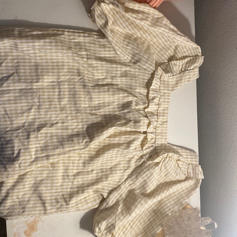 Yellow and white tiled shirt. Puffy sleeves, rectangle neck line.